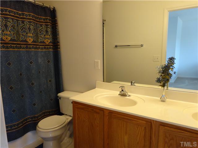 2208 Tucca Way Raleigh, NC 27604 - Photo 11 of 18 a bathroom with a sink and a toilet