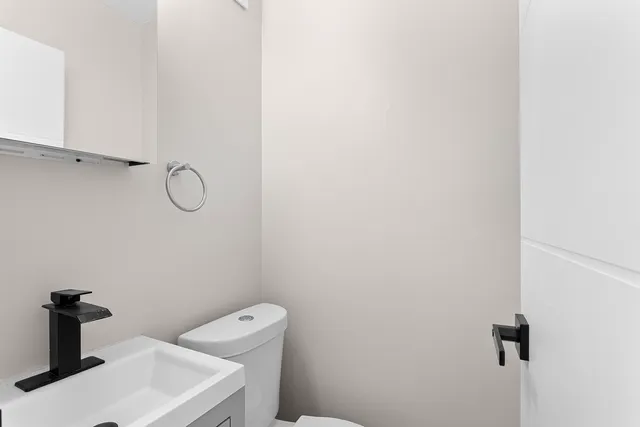 a bathroom with a sink and vanity