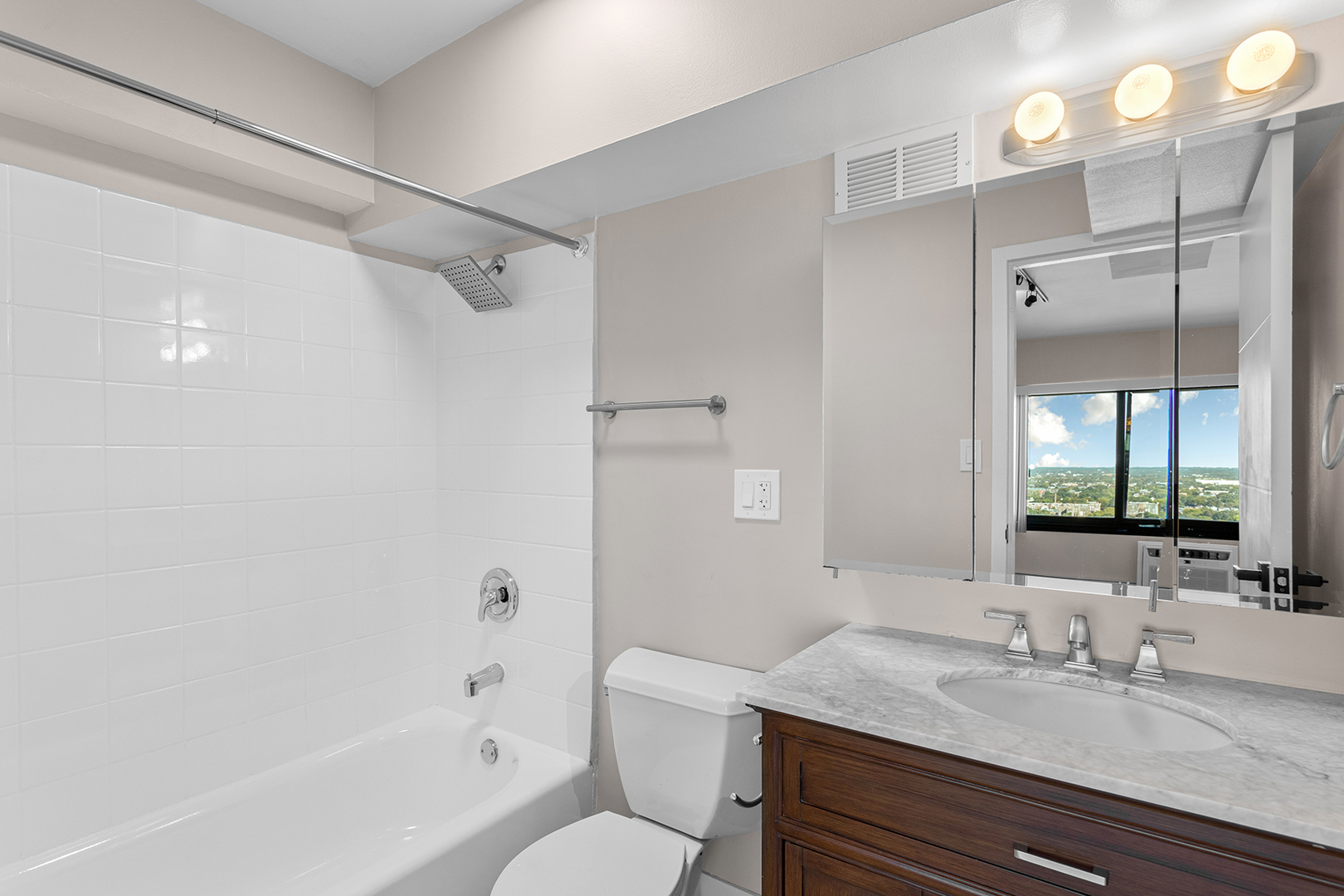 6166 North Sheridan Road, Unit 28A Chicago, IL 60660 - Photo 10 of 18 a bathroom with a granite countertop sink toilet and shower