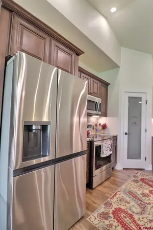a bedroom with a bed and ceiling fan