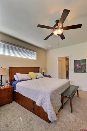 a view of room with window and dresser