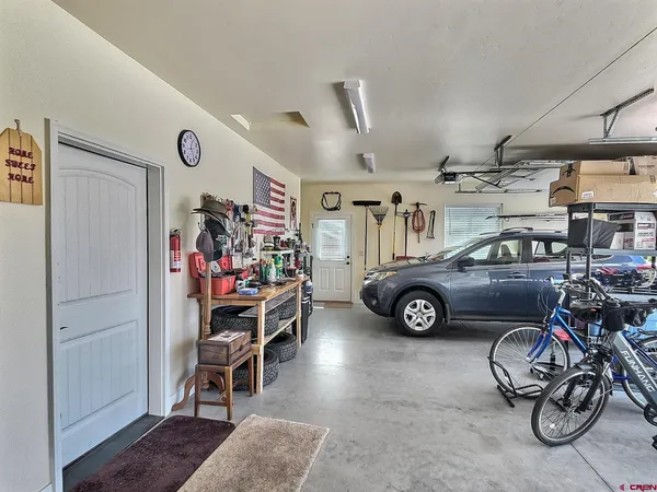 a view of a house with a backyard and a patio
