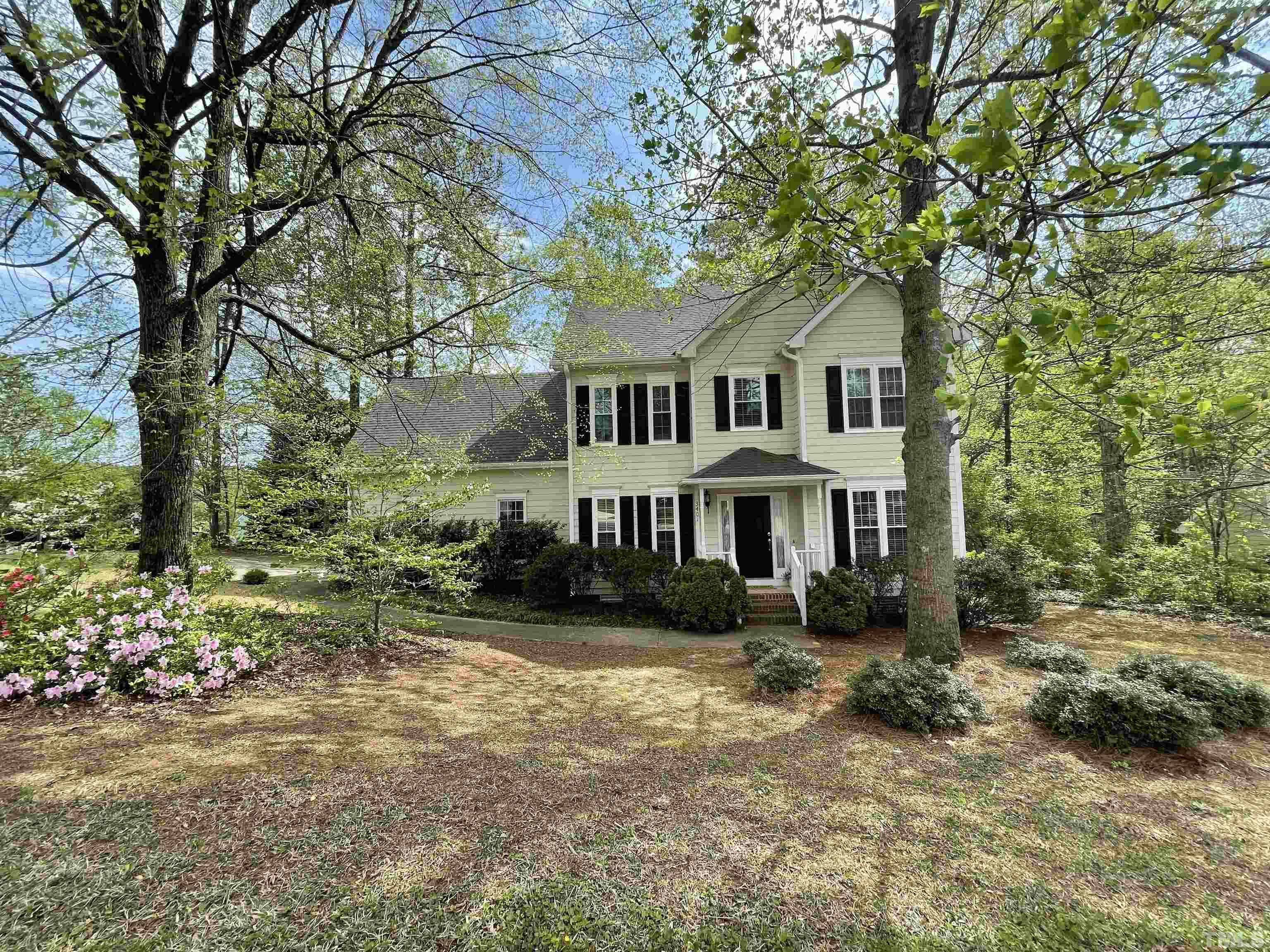 3401 Savan Court Raleigh, NC 27613 - Photo 2 of 27 a front view of a house with garden