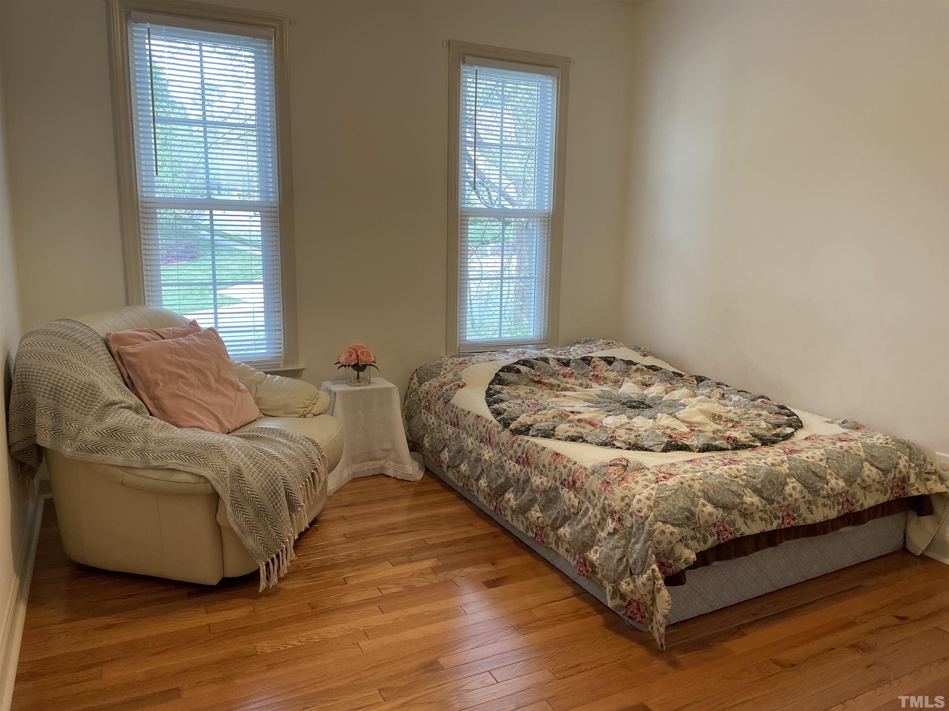 3401 Savan Court Raleigh, NC 27613 - Photo 22 of 27 a bedroom with a bed and window