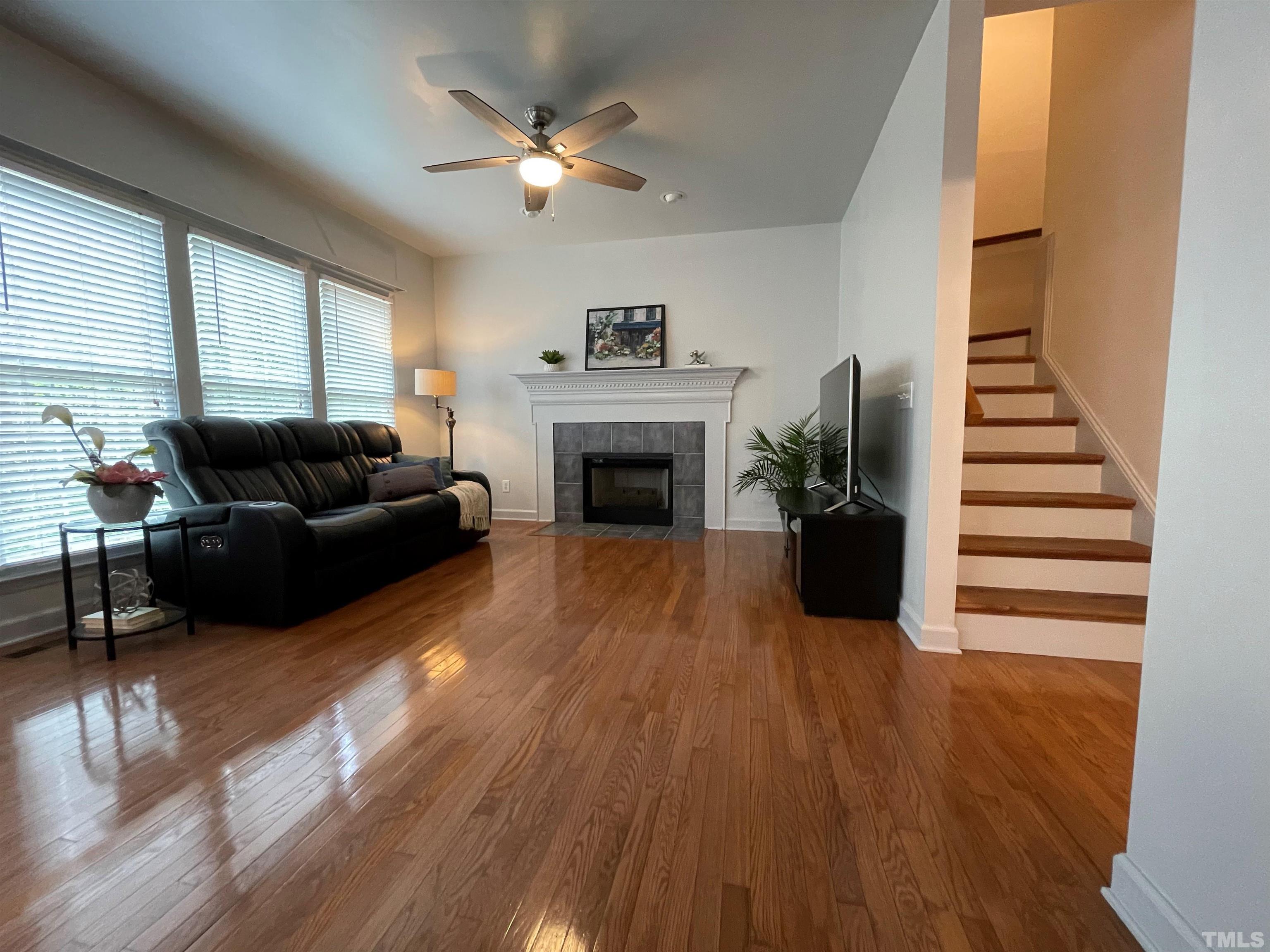 3401 Savan Court Raleigh, NC 27613 - Photo 5 of 27 a living room with furniture and a fireplace