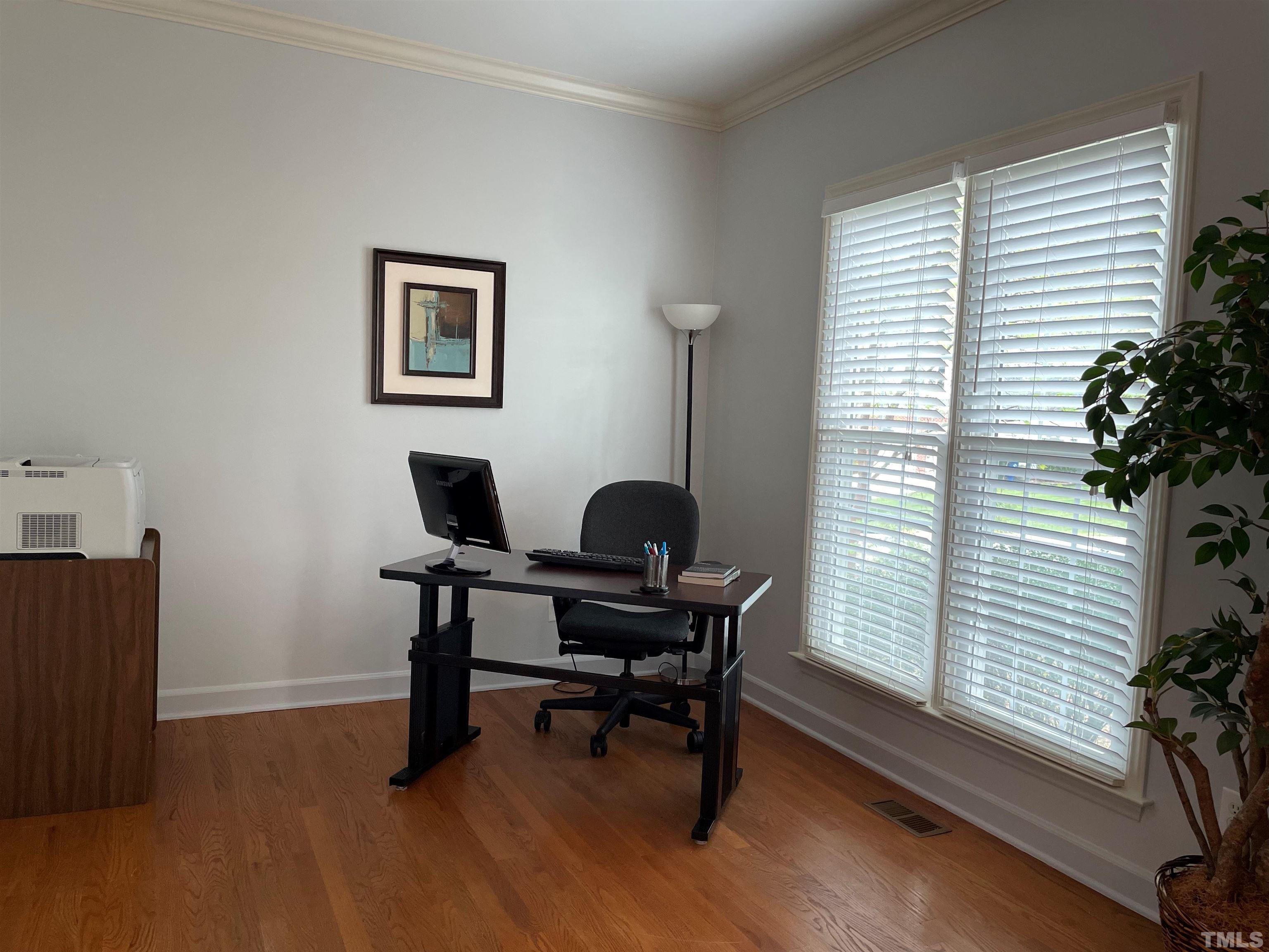 3401 Savan Court Raleigh, NC 27613 - Photo 6 of 27 a view of a workspace with furniture and a window