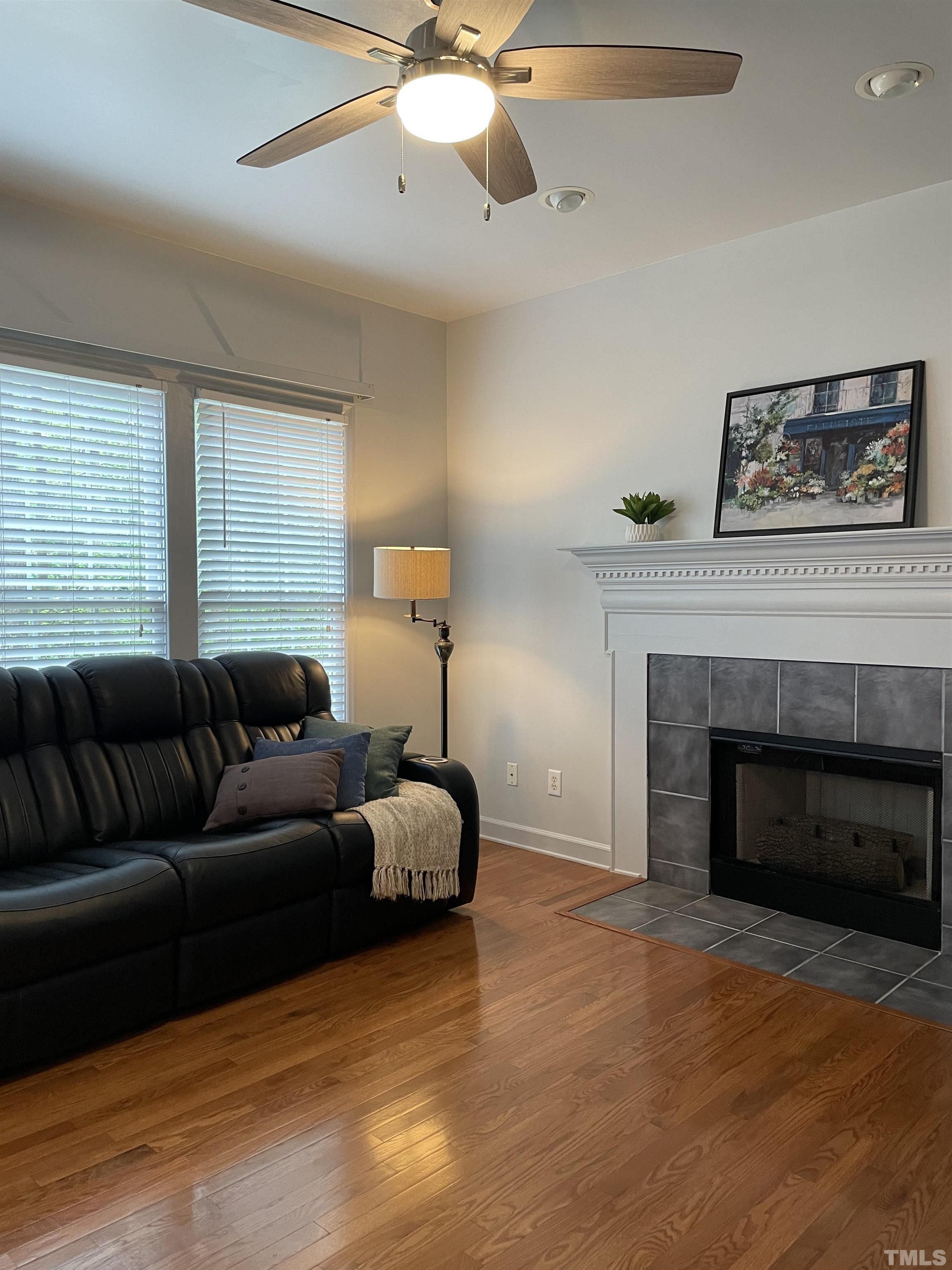 3401 Savan Court Raleigh, NC 27613 - Photo 7 of 27 a living room with furniture and a fireplace