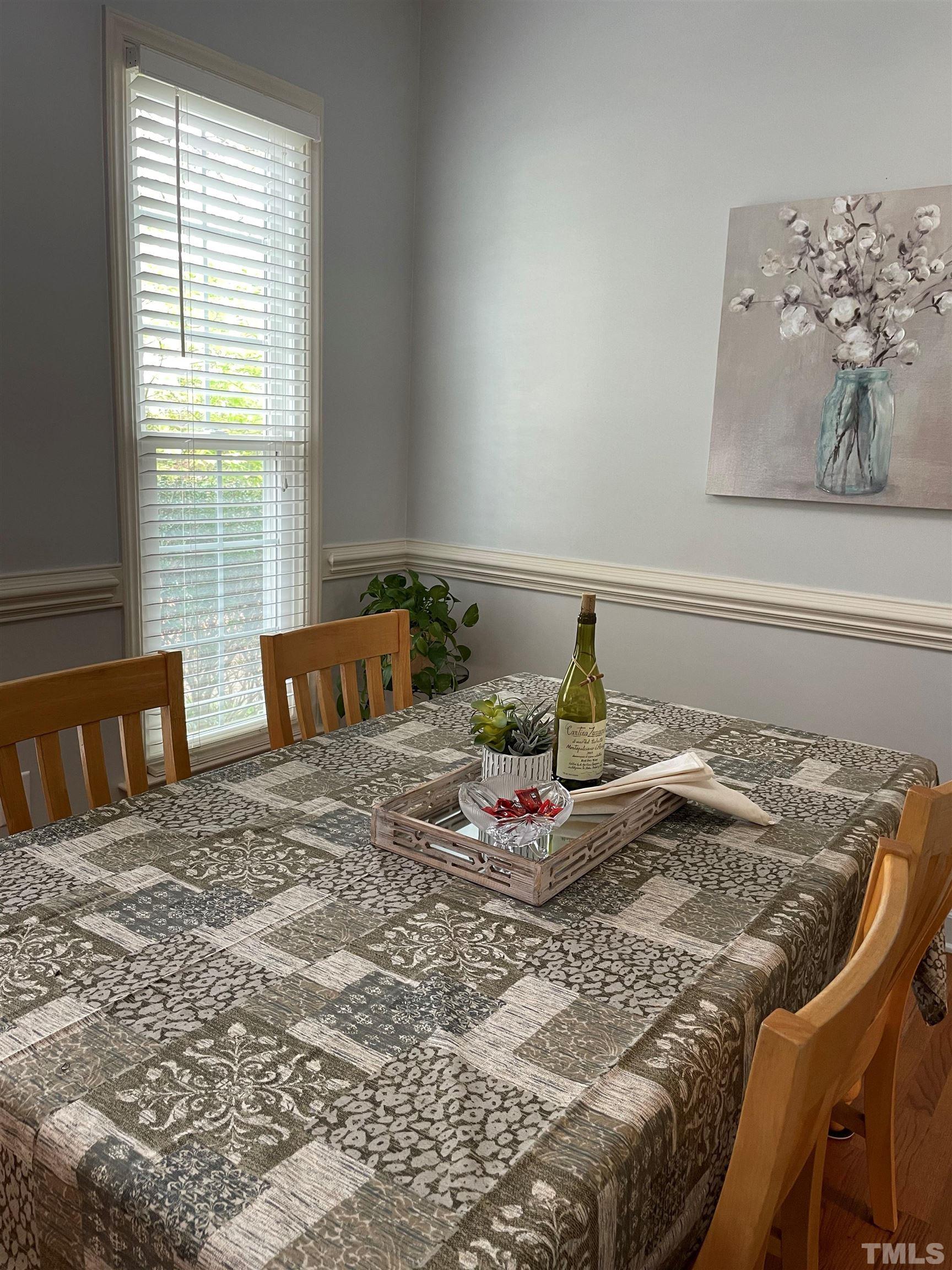 3401 Savan Court Raleigh, NC 27613 - Photo 9 of 27 a bedroom with a bed and window