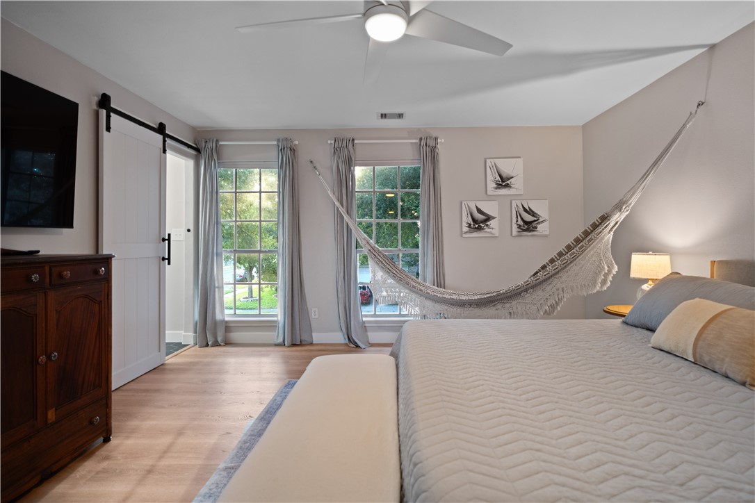 7654 Timber Crest Drive Corpus Christi, TX 78413 - Photo 22 of 35 a bedroom with a bed and a window