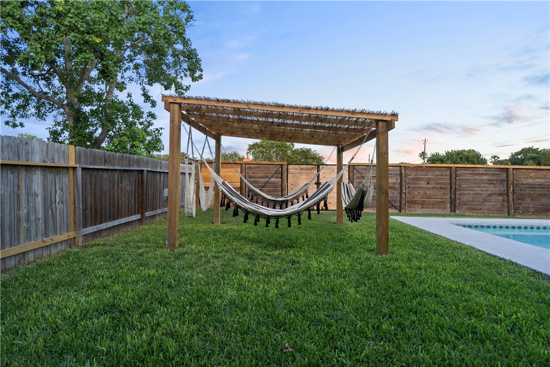 7654 Timber Crest Drive Corpus Christi, TX 78413 - Photo 25 of 35 a view of a backyard with wooden fence
