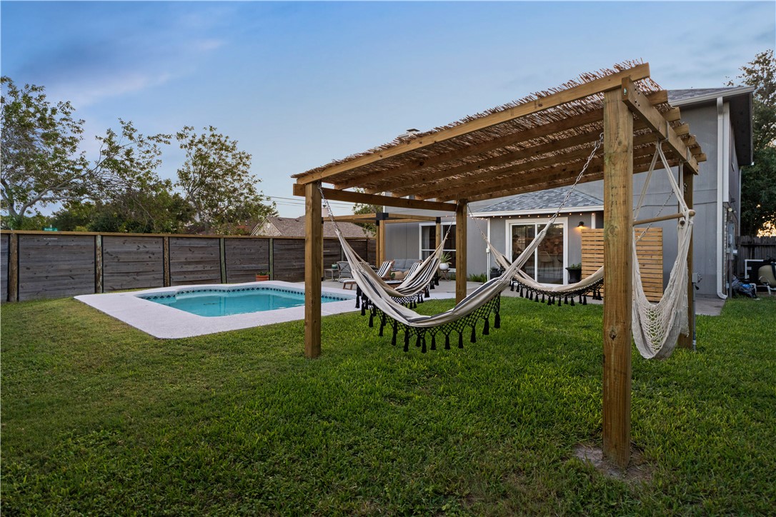 7654 Timber Crest Drive Corpus Christi, TX 78413 - Photo 26 of 35 a view of a chair and table in backyard