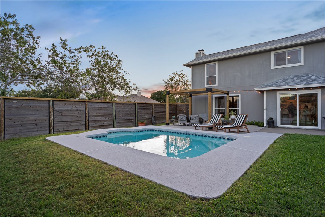 7654 Timber Crest Drive Corpus Christi, TX 78413 - Photo 28 of 35 a view of a house with swimming pool and sitting area