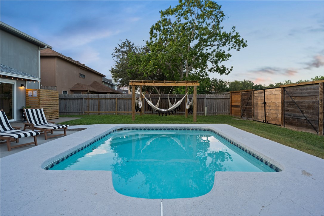 7654 Timber Crest Drive Corpus Christi, TX 78413 - Photo 29 of 35 a view of a swimming pool with a patio