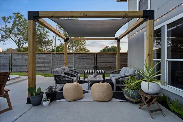 a balcony with a bench and painted walls