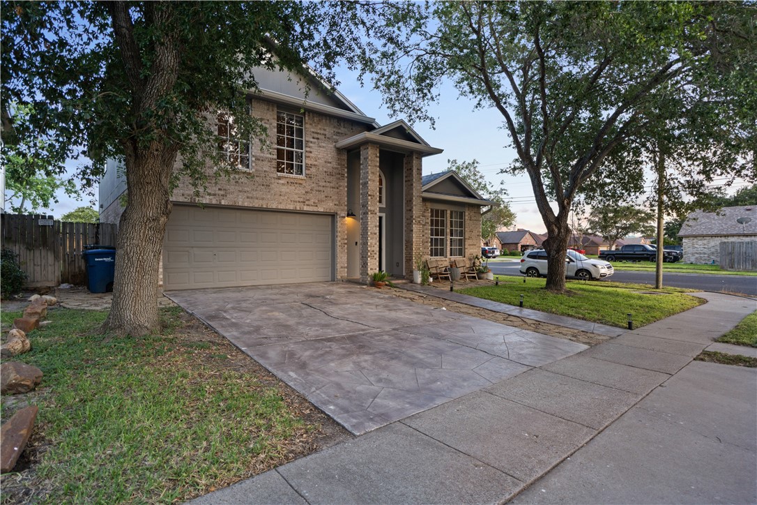 7654 Timber Crest Drive Corpus Christi, TX 78413 - Photo 33 of 35 a front view of a house with garden