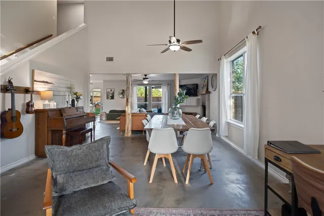 a dining room with furniture a rug and wooden floor