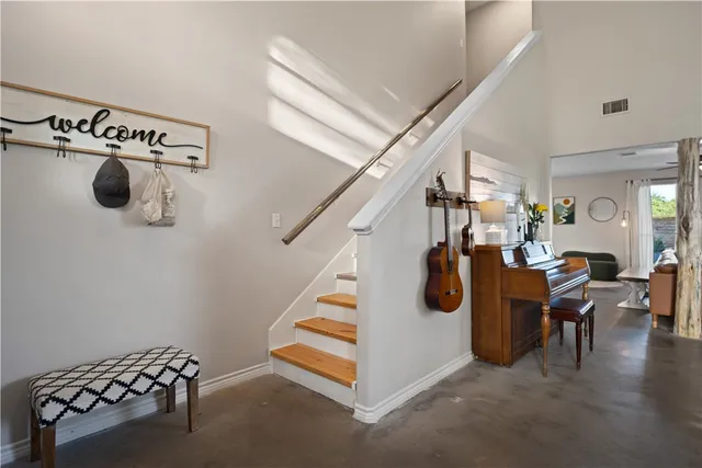 a living room with furniture and a rug