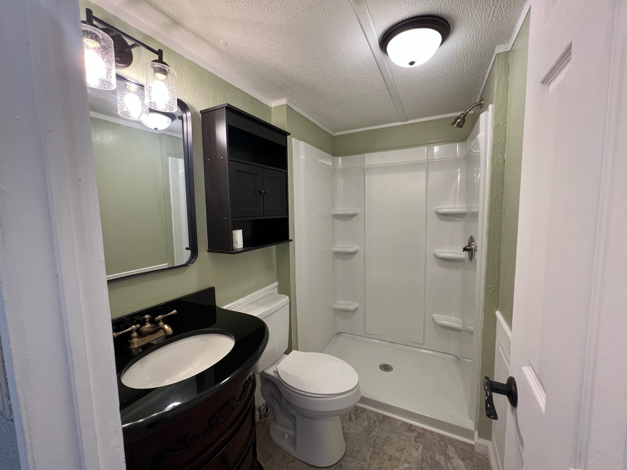 511 Hall-Leffew Road Franklin, KY 42134 - Photo 13 of 26 a bathroom with a sink a toilet a mirror and shower