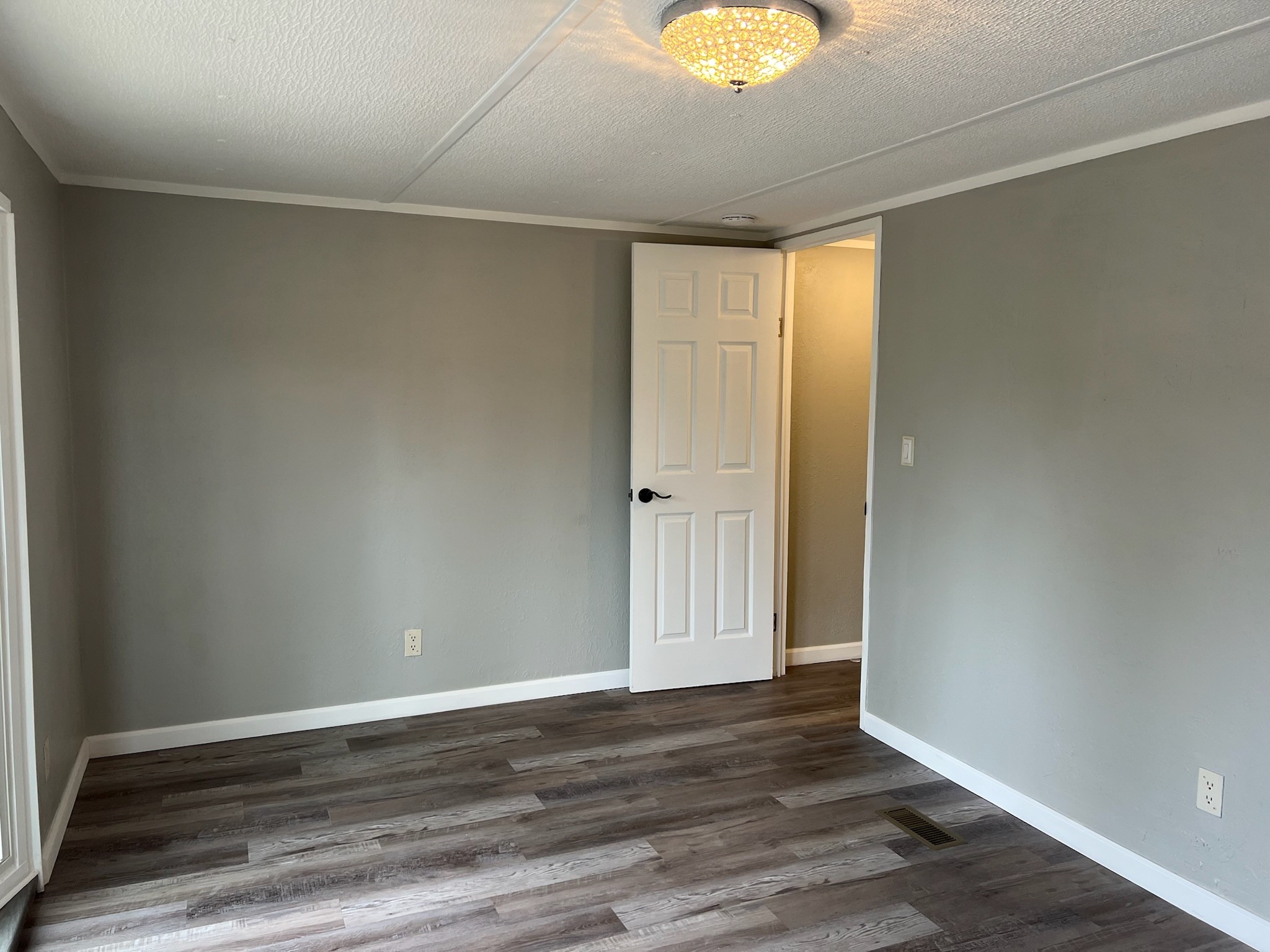 511 Hall-Leffew Road Franklin, KY 42134 - Photo 15 of 26 an empty room with wooden floor and windows