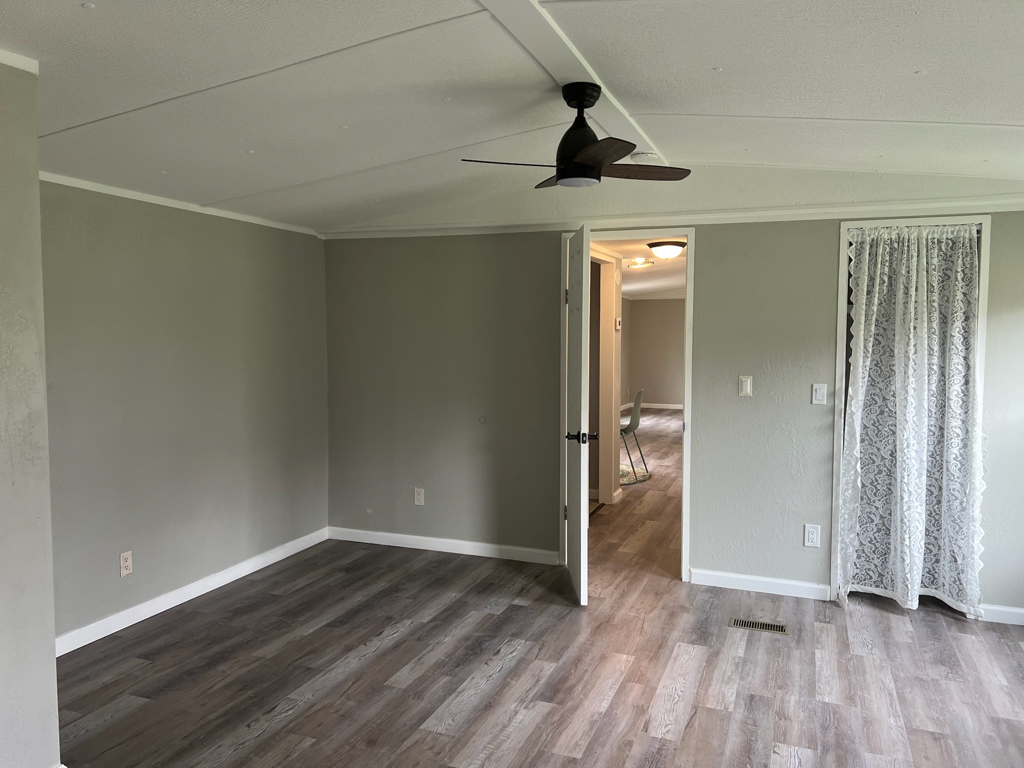 511 Hall-Leffew Road Franklin, KY 42134 - Photo 10 of 26 wooden floor in an empty room with a window