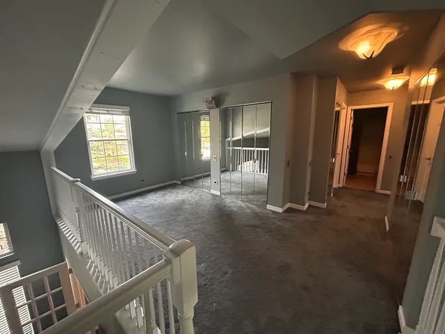 a view of empty room with windows