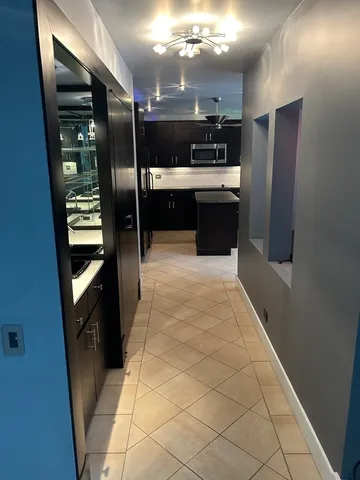 a kitchen with stainless steel appliances a refrigerator and a sink