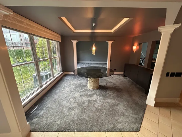 a bedroom with a bed and a mirror