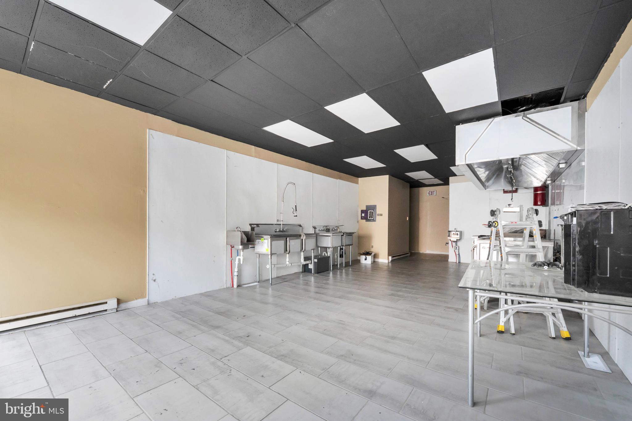 3706 Garrett Road Drexel Hill, PA 19026 - Photo 3 of 15 a dining room with furniture and a chandelier