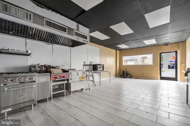 a kitchen with a stove and a microwave