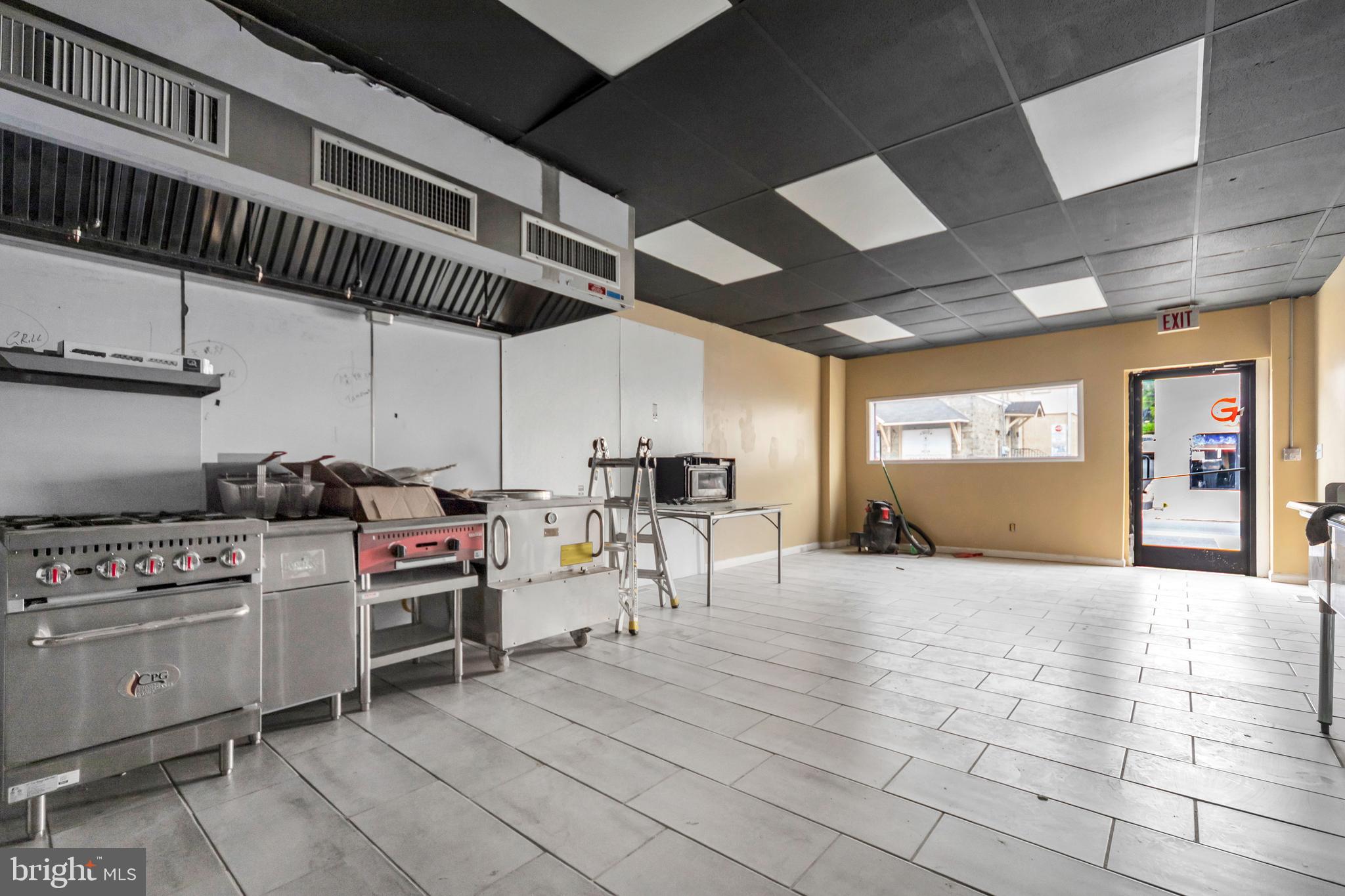3706 Garrett Road Drexel Hill, PA 19026 - Photo 5 of 15 a kitchen with a stove and a microwave
