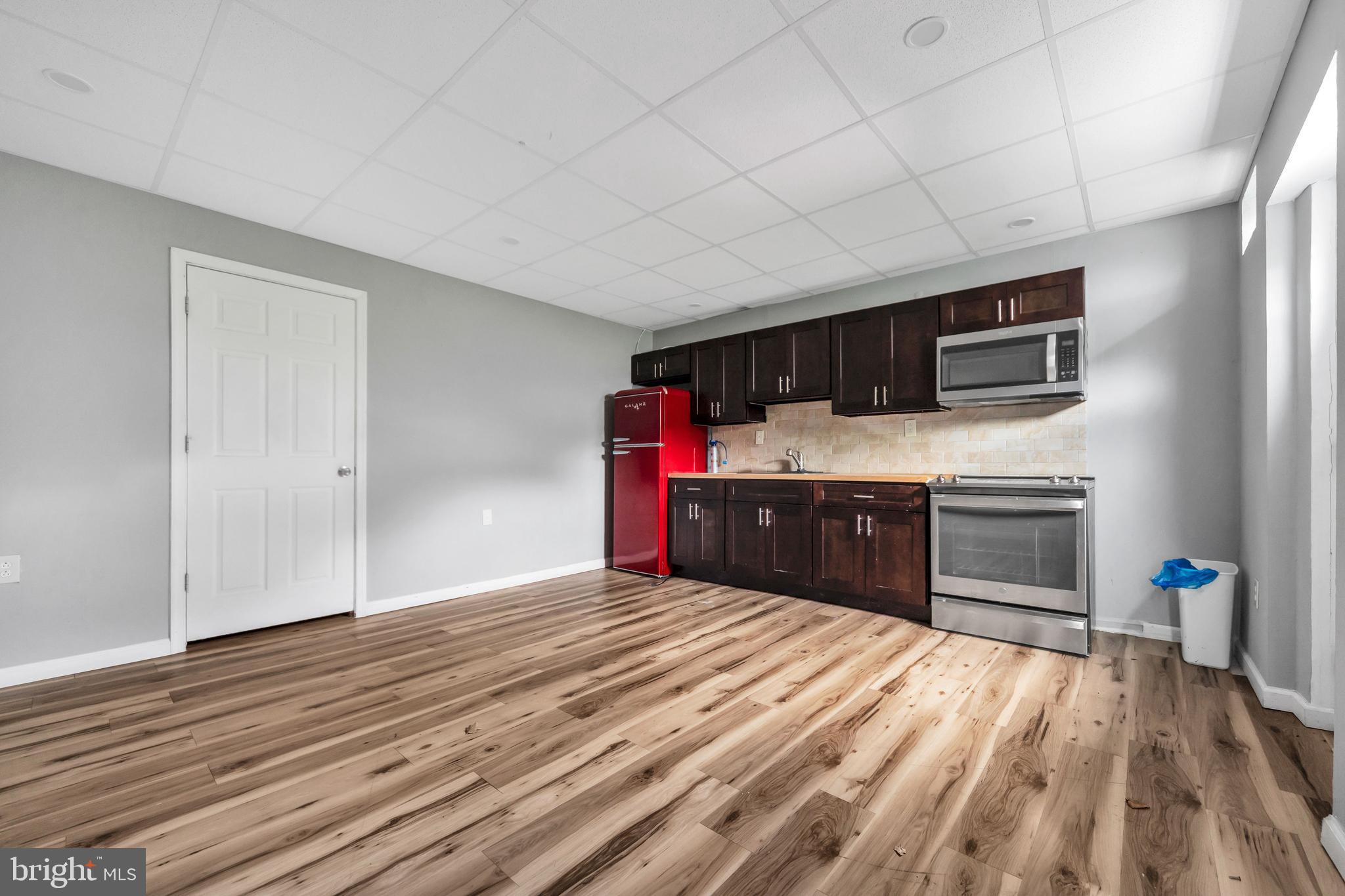 3706 Garrett Road Drexel Hill, PA 19026 - Photo 10 of 15 a kitchen with stainless steel appliances a stove top oven and a refrigerator