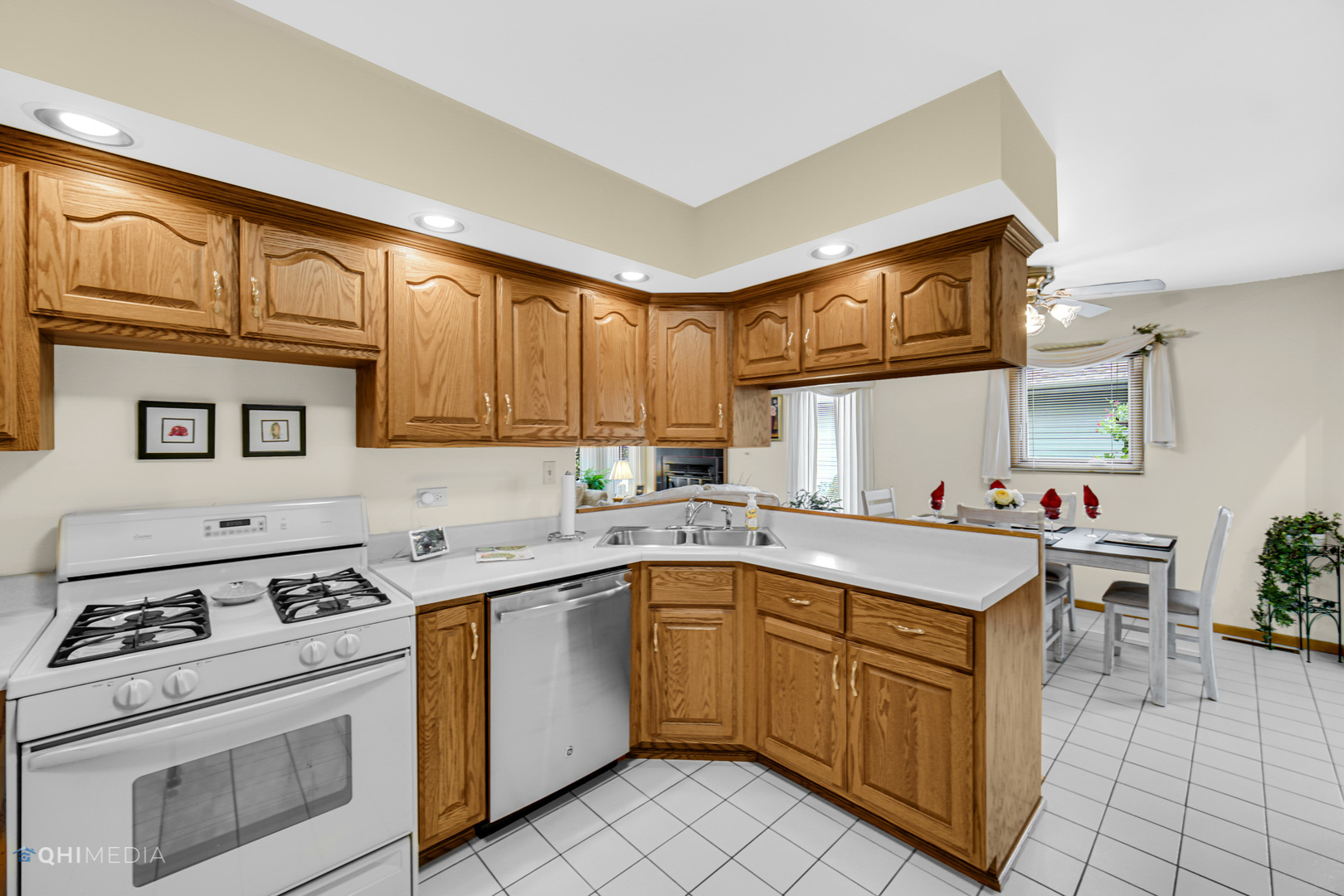 17638 Wright Street Lansing, IL 60438 - Photo 11 of 30 a kitchen with a sink stove top oven and cabinets