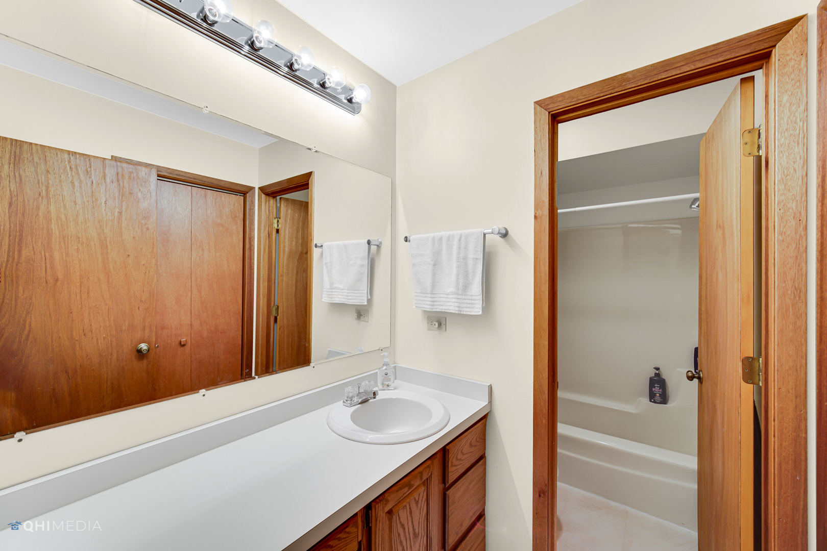 17638 Wright Street Lansing, IL 60438 - Photo 19 of 30 a bathroom with a sink and a mirror