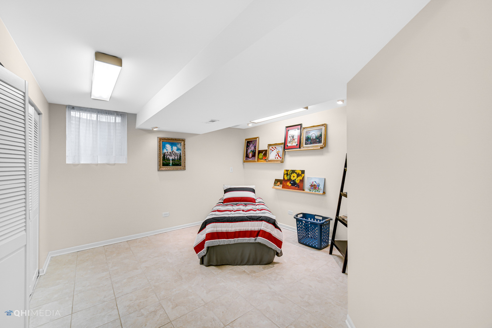 17638 Wright Street Lansing, IL 60438 - Photo 20 of 30 a bedroom with a bed and a couch