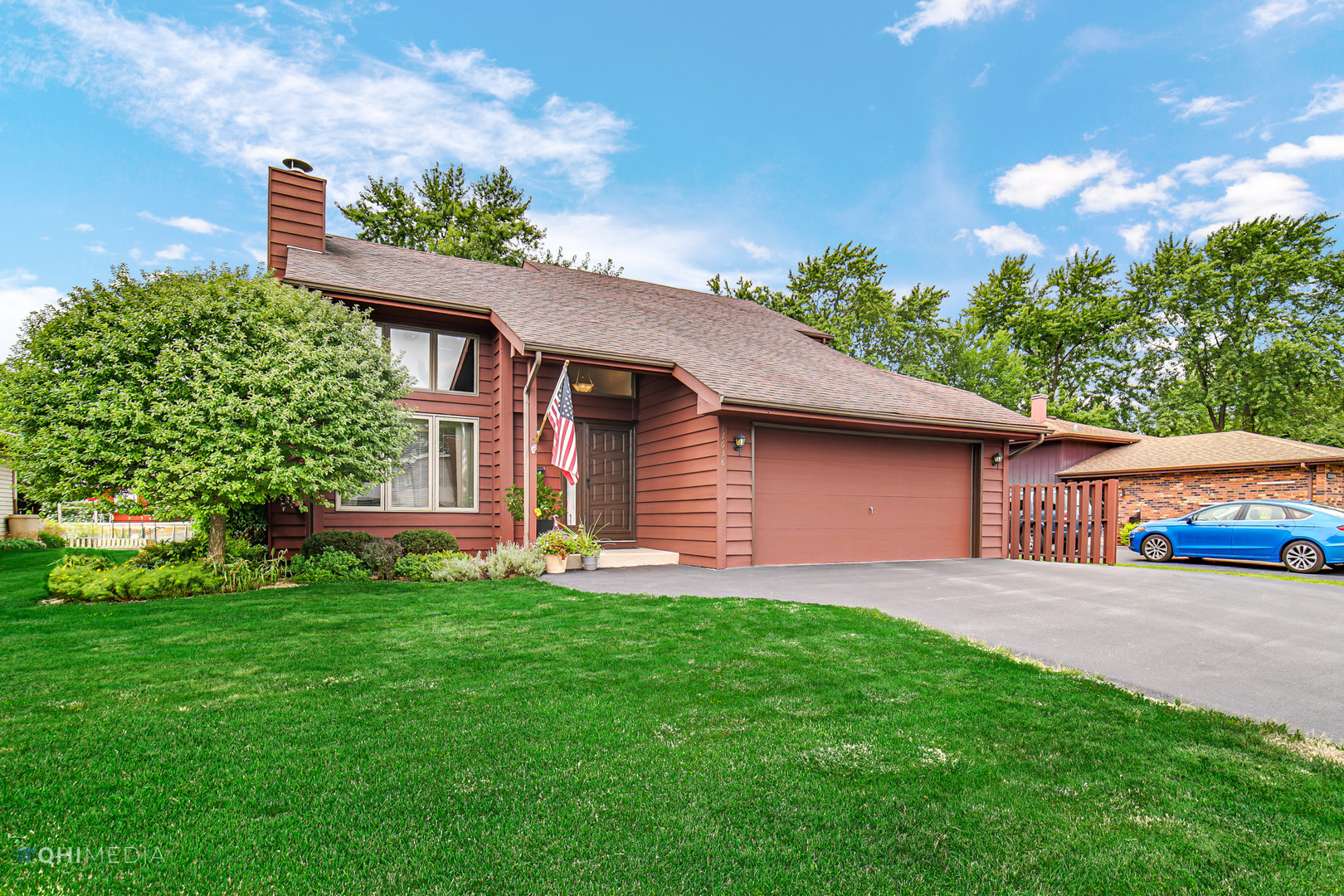 17638 Wright Street Lansing, IL 60438 - Photo 30 of 30 a front view of a house with a yard and garage