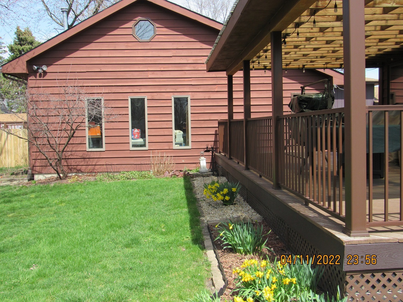 17638 Wright Street Lansing, IL 60438 - Photo 4 of 30 a front view of a house with a garden