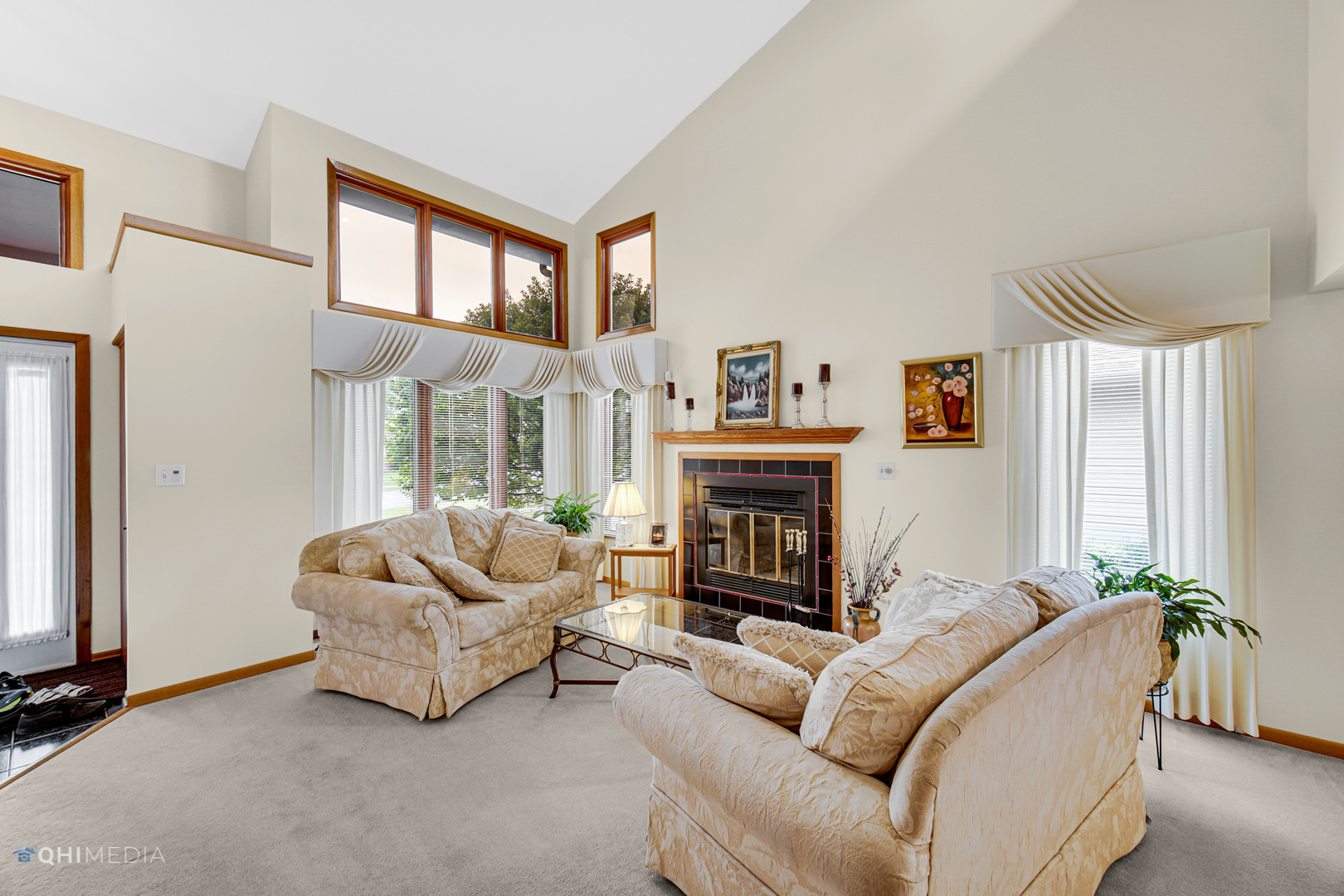 17638 Wright Street Lansing, IL 60438 - Photo 6 of 30 a living room with furniture a fireplace and a large window