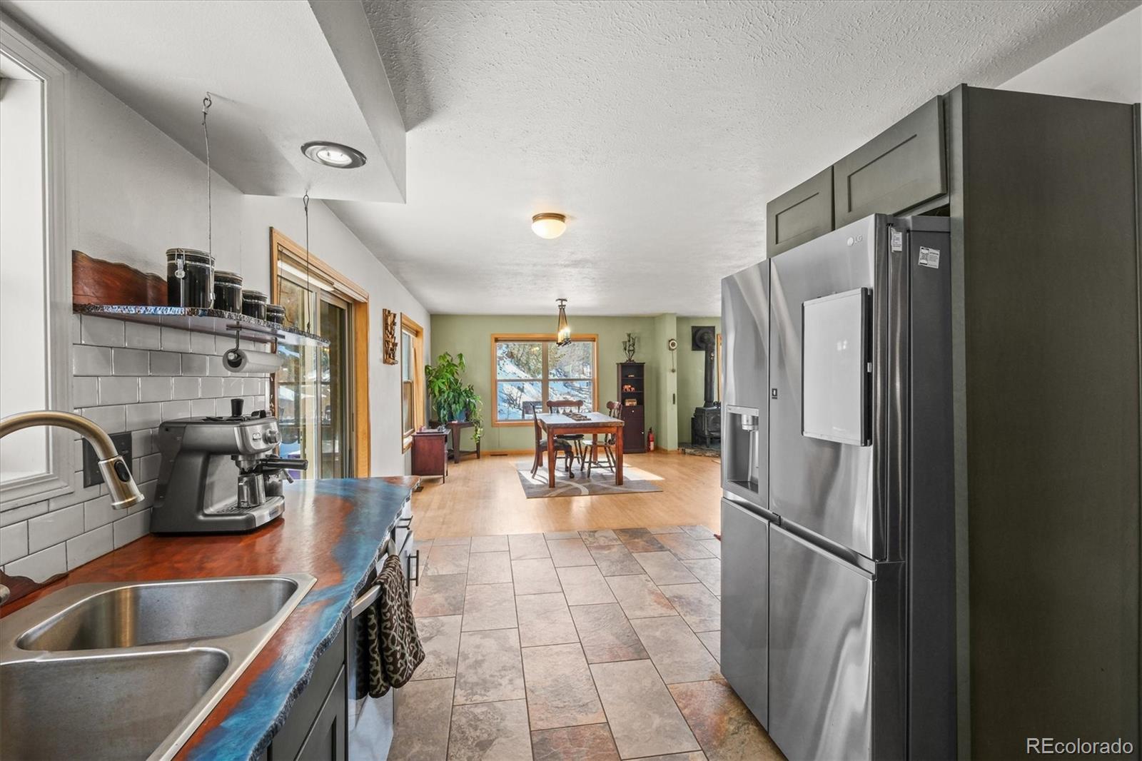 2476 South Beaver Creek Road Black Hawk, CO 80422 - Photo 12 of 21 a kitchen with refrigerator and cabinets