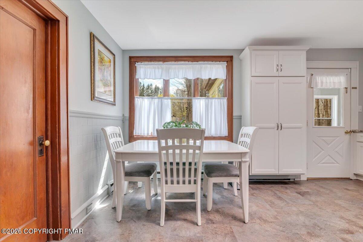253 Thomas Road Blakeslee, PA 18610 - Photo 19 of 63 a view of a dining room with furniture window and outside view