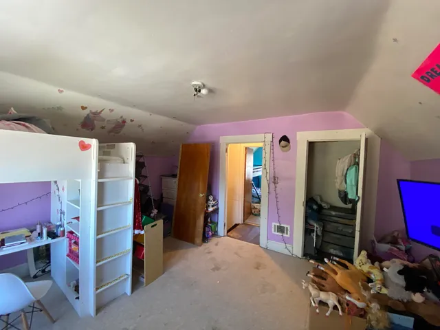 a view of livingroom with furniture and toys