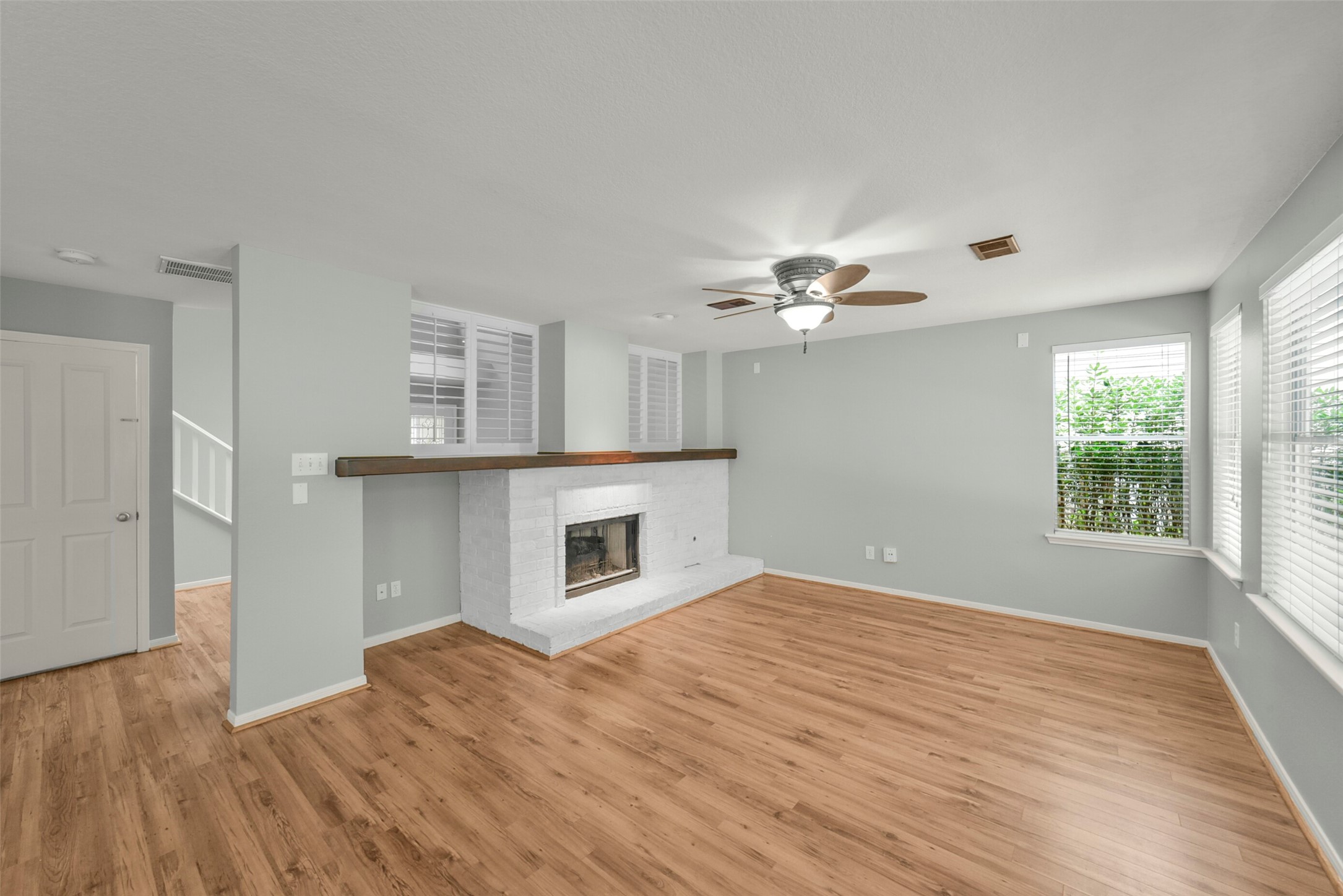 22 East New Avery Place Spring, TX 77382 - Photo 7 of 46 Livingroom downstairs with a gas fire place.