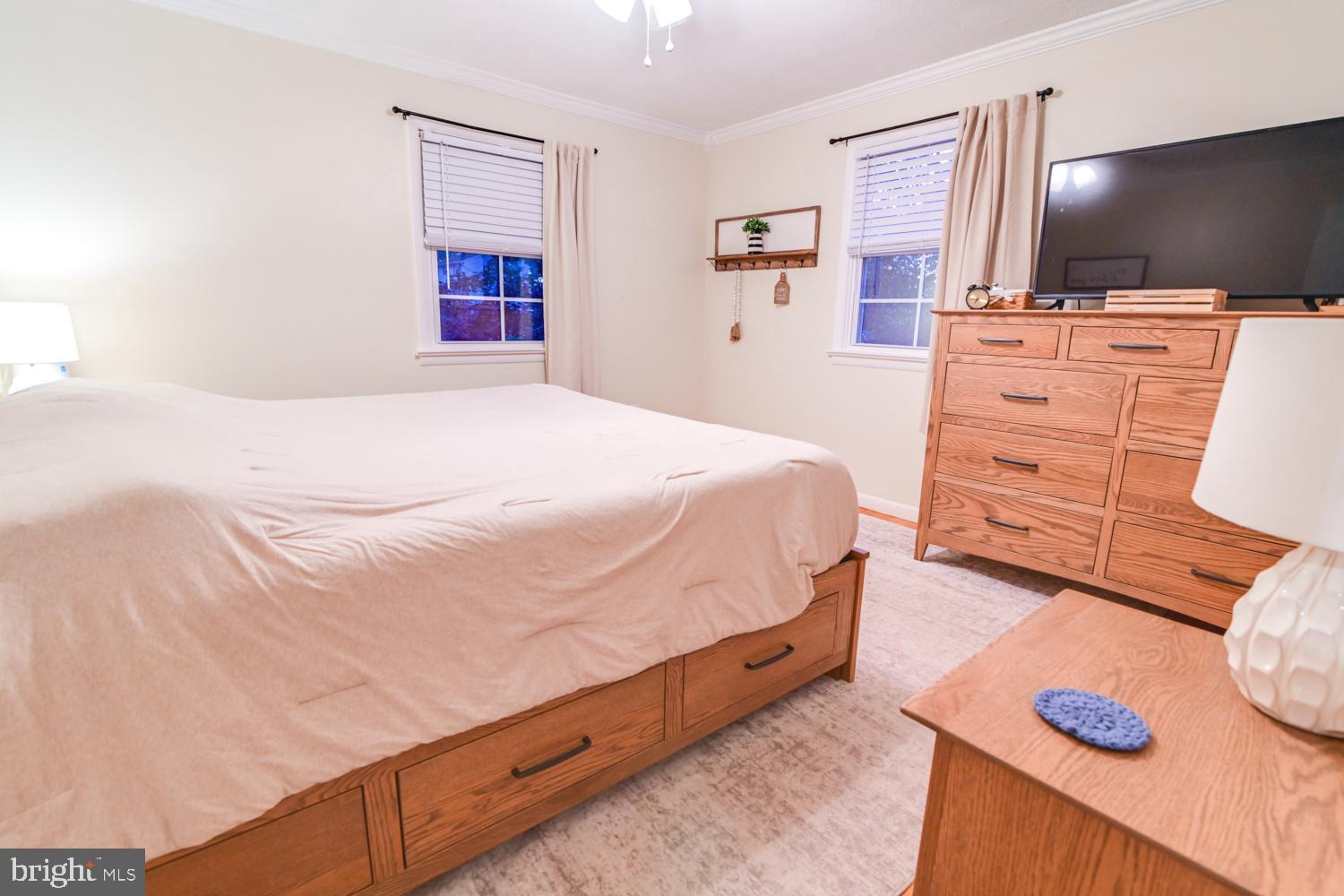 146 Lexington Road York, PA 17402 - Photo 20 of 35 a bedroom with a bed and a flat screen tv
