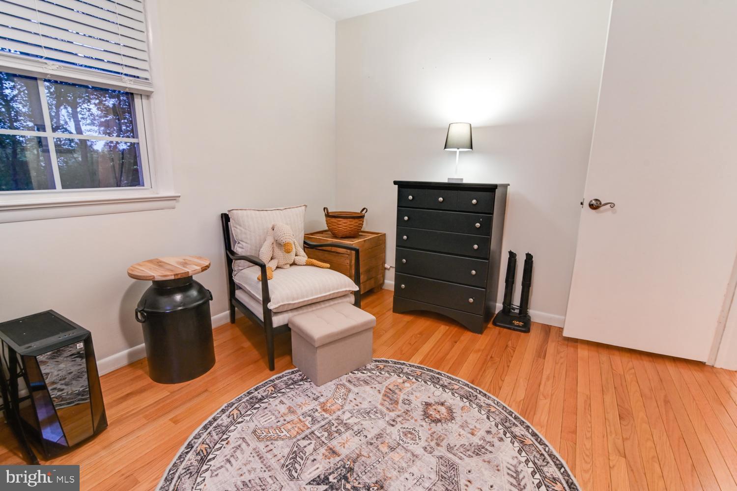 146 Lexington Road York, PA 17402 - Photo 21 of 35 a bedroom with a bed and wooden floor