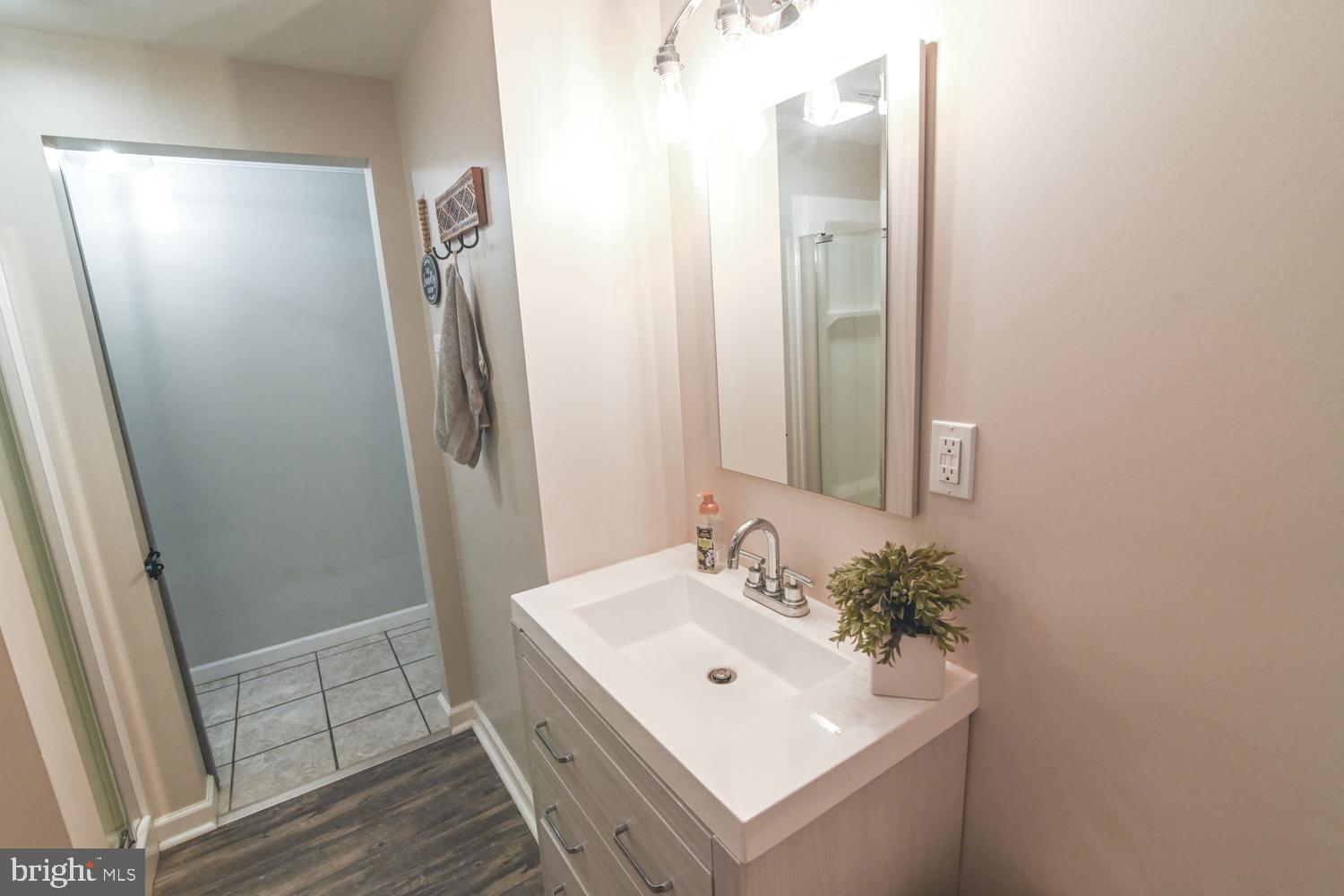 146 Lexington Road York, PA 17402 - Photo 35 of 35 a bathroom with a sink a mirror and shower