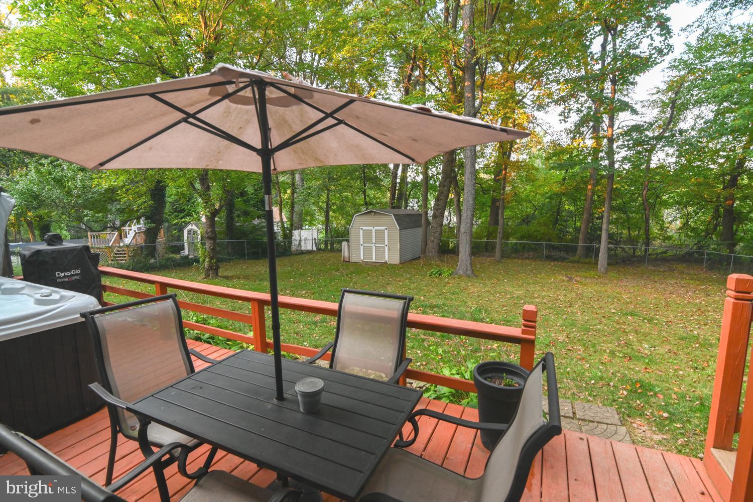 146 Lexington Road York, PA 17402 - Photo 6 of 35 a view of a patio with chairs and a table under an umbrella