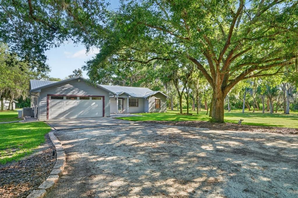171 William Street Edgewater, FL 32141 - Photo 3 of 40 a view of a house with a yard