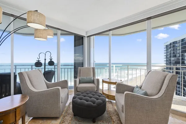 a view of a dining room with furniture window and outside view