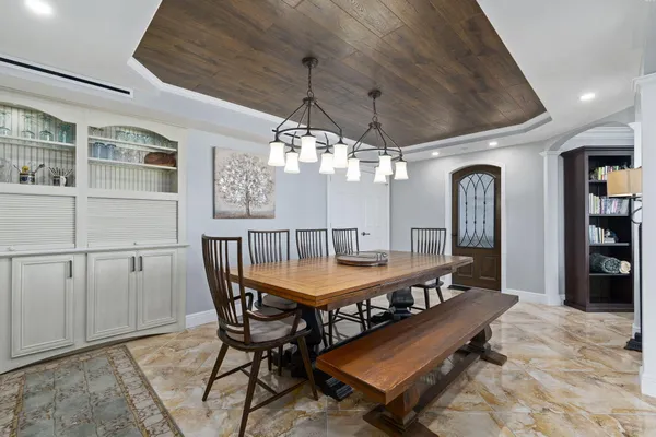 a workspace with furniture window and a ceiling fan