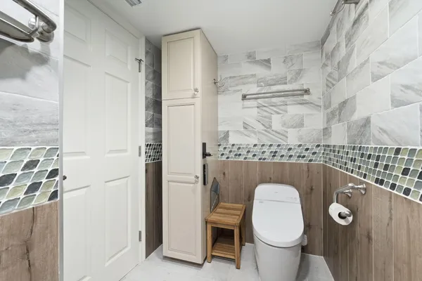 a spacious bathroom with a granite countertop sink and a mirror