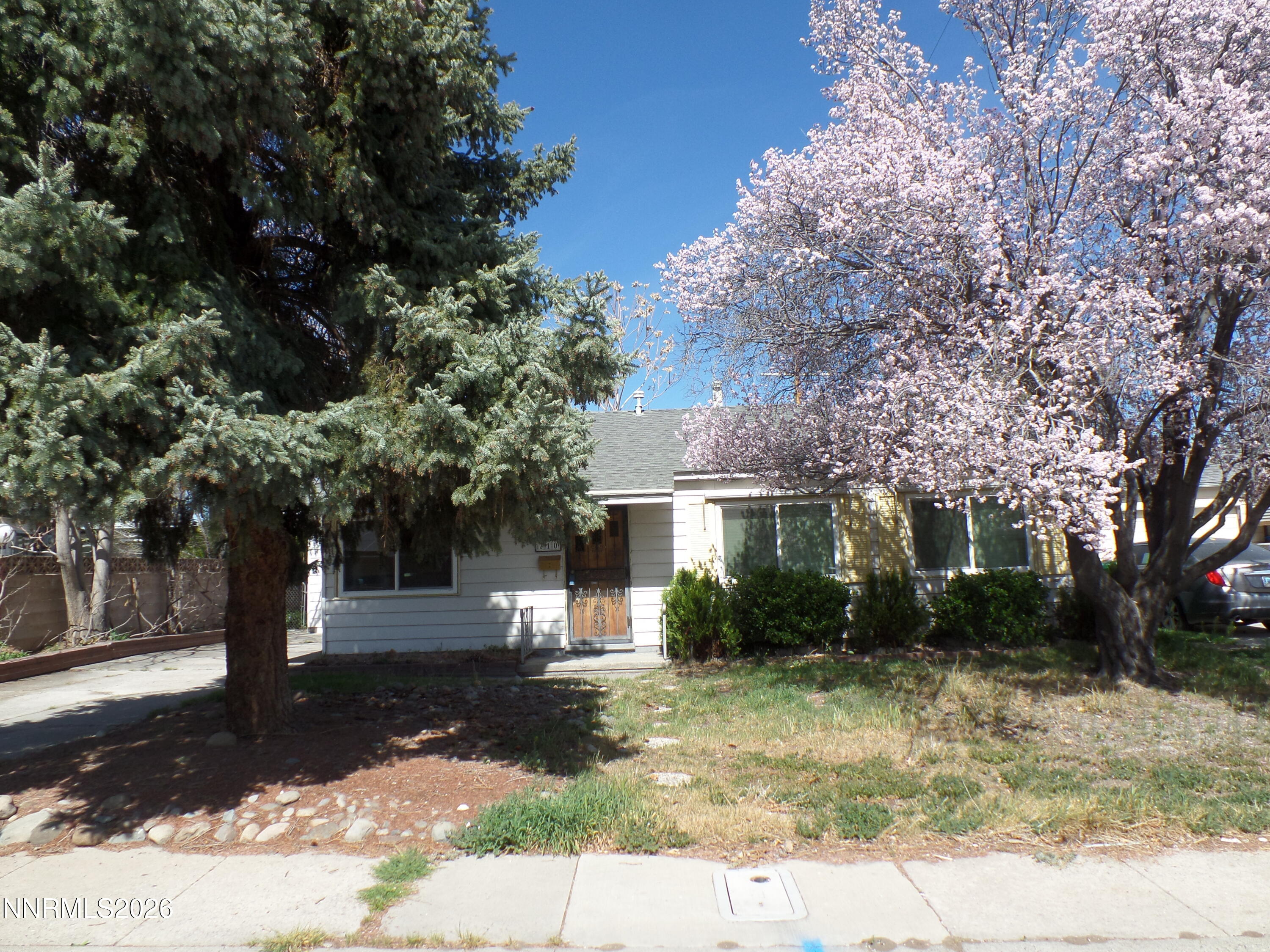 710 L Street Sparks, NV 89431 - Photo 1 of 11 a front view of a house with a garden